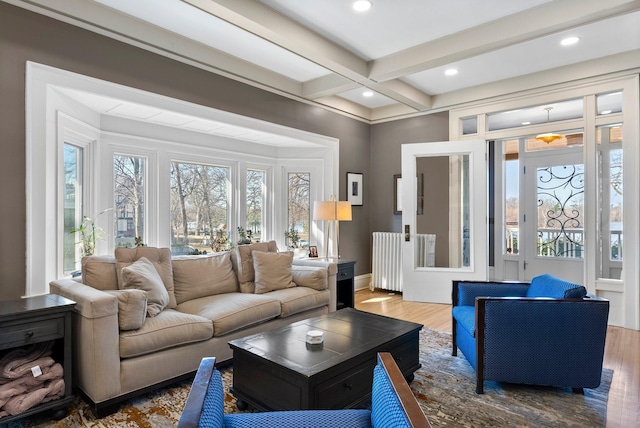 living area featuring beam ceiling, coffered ceiling, wood finished floors, recessed lighting, and baseboards