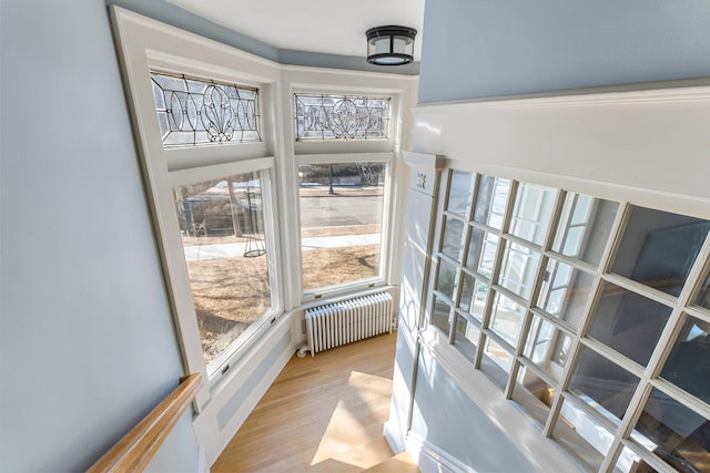 sunroom with radiator heating unit