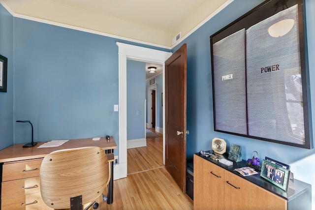 office with visible vents, baseboards, and light wood-style floors