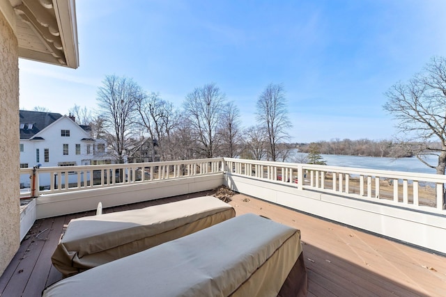 wooden deck with a water view