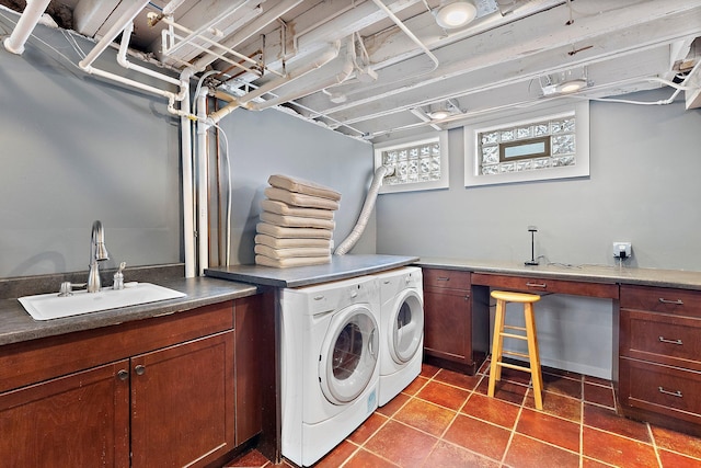 laundry room with a sink, cabinet space, tile patterned floors, and washer and dryer