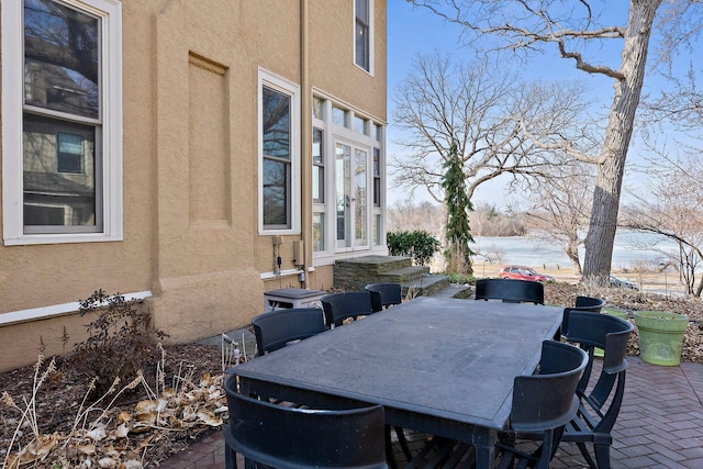 view of patio / terrace featuring entry steps and outdoor dining area