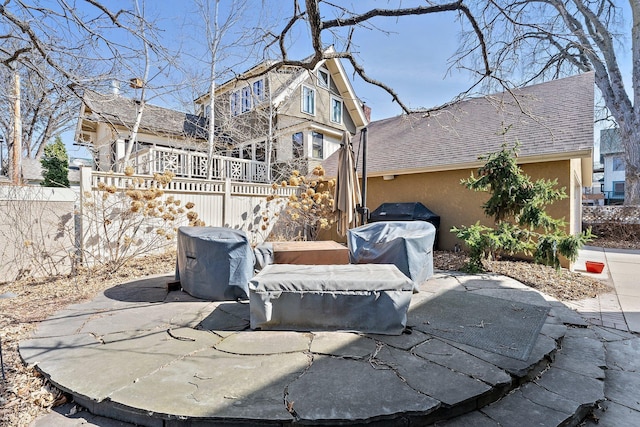 view of patio / terrace with area for grilling and fence