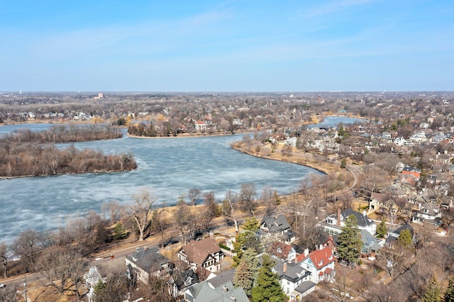 drone / aerial view featuring a residential view and a water view