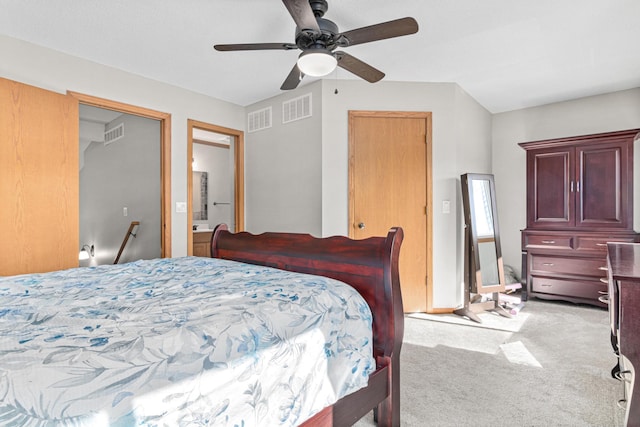 bedroom featuring visible vents, light carpet, and a ceiling fan