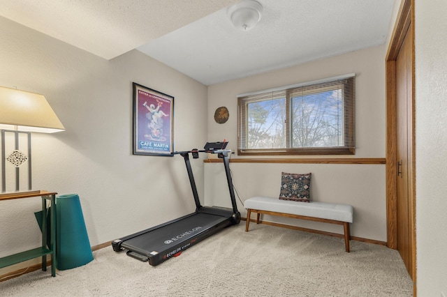 workout area with carpet floors and baseboards