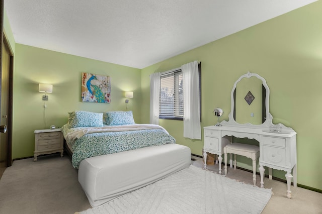 bedroom featuring carpet floors and baseboards