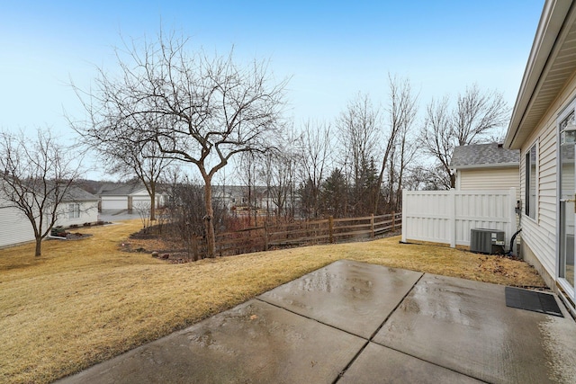 view of yard with a patio area, fence, and cooling unit