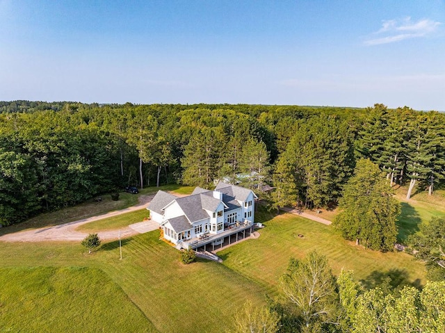 drone / aerial view featuring a forest view