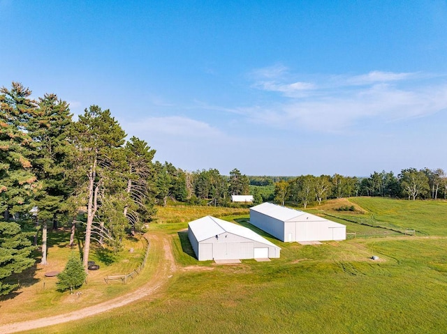 view of storm shelter with an outbuilding and a yard