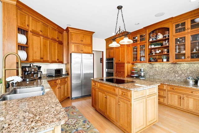 kitchen with appliances with stainless steel finishes, open shelves, a sink, and a center island