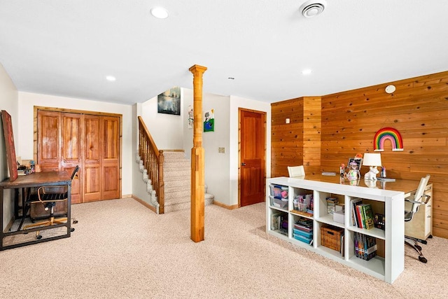 recreation room with light carpet, wooden walls, baseboards, visible vents, and recessed lighting