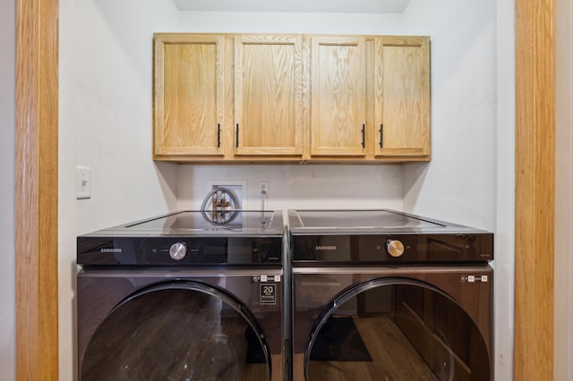 laundry room featuring cabinet space and washing machine and dryer