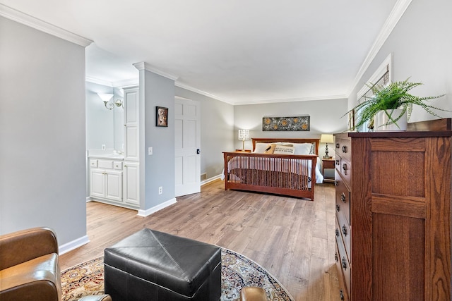 bedroom featuring ornamental molding, light wood-style flooring, and baseboards