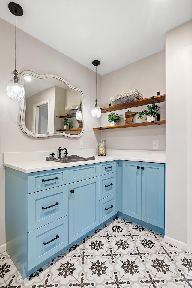 bathroom with vanity and baseboards