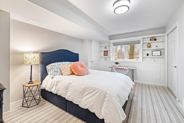 carpeted bedroom featuring baseboards