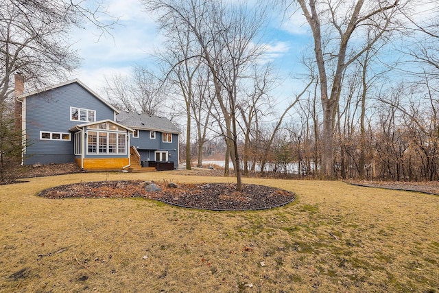 view of yard with a sunroom