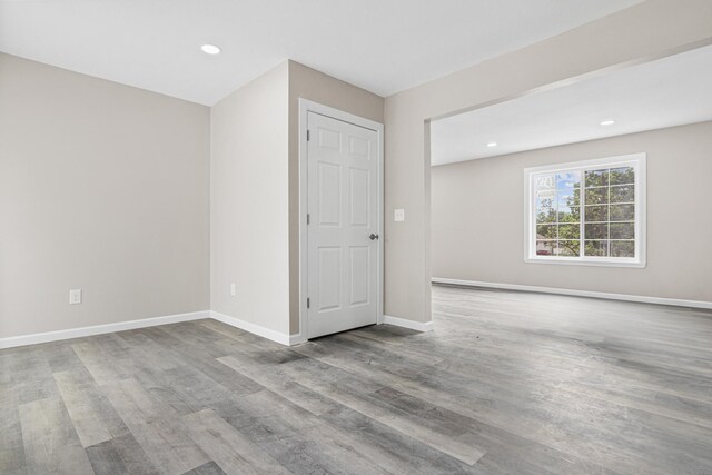 2310 Leona Dr, New Brighton, MN 55112 - empty room featuring wood finished floors, recessed lighting, and baseboards