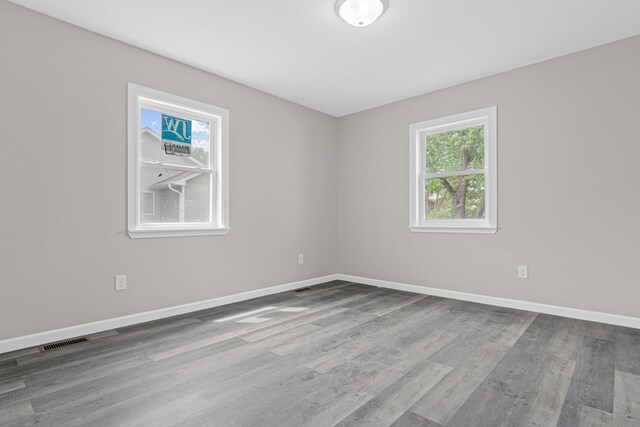 2310 Leona Dr, New Brighton, MN 55112 - unfurnished room featuring wood finished floors and baseboards