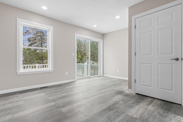 2310 Leona Dr, New Brighton, MN 55112 - unfurnished room with baseboards, wood finished floors, and recessed lighting
