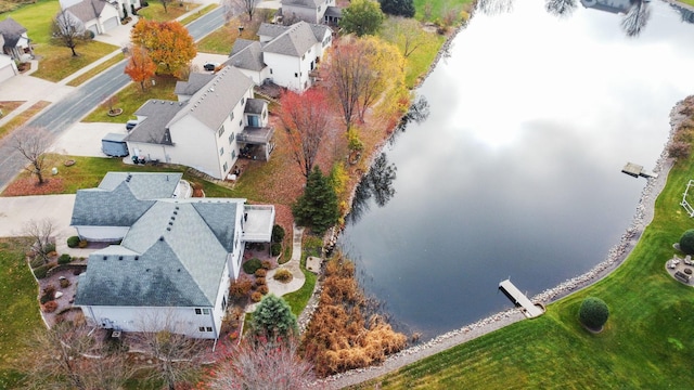 birds eye view of property featuring a water view and a residential view