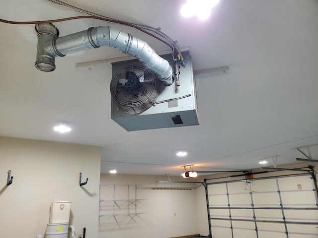 10590 Alamo St NE, Blaine, MN 55449 - garage featuring a garage door opener and a heating unit