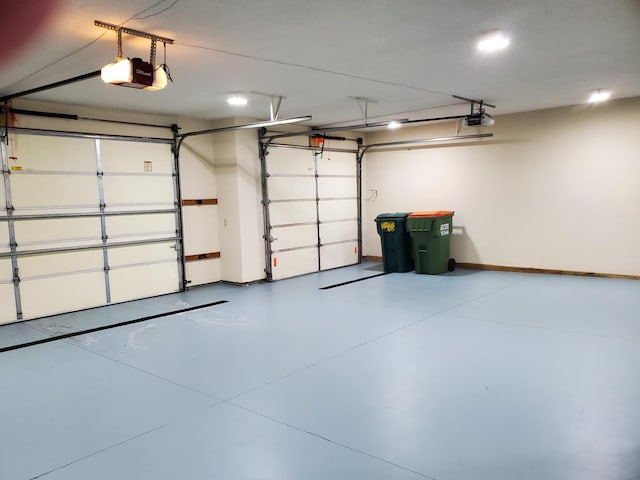 10590 Alamo St NE, Blaine, MN 55449 - garage with a garage door opener and baseboards