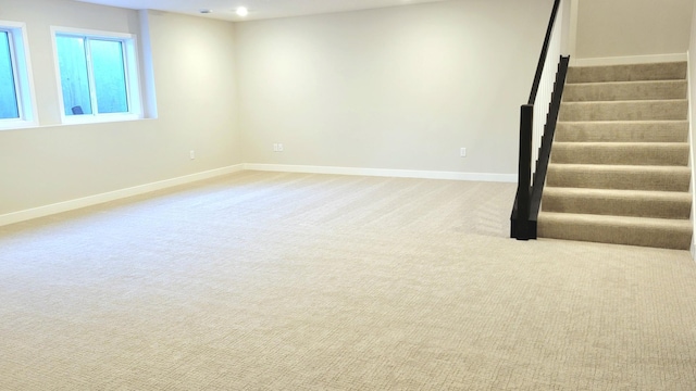 basement with carpet floors, recessed lighting, stairway, and baseboards