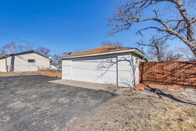 detached garage with fence