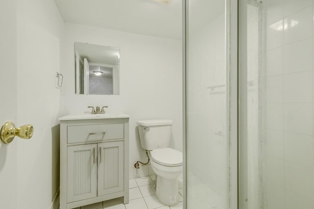 bathroom with toilet, tile patterned flooring, and vanity