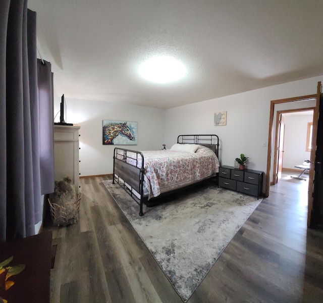 bedroom with wood finished floors