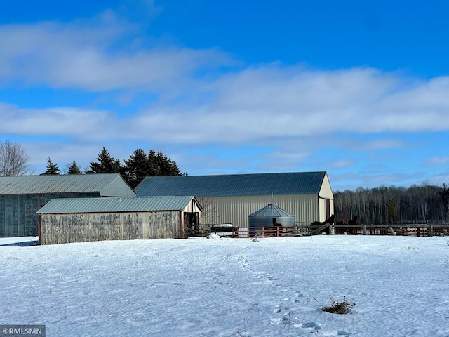 exterior space with an outdoor structure and a pole building