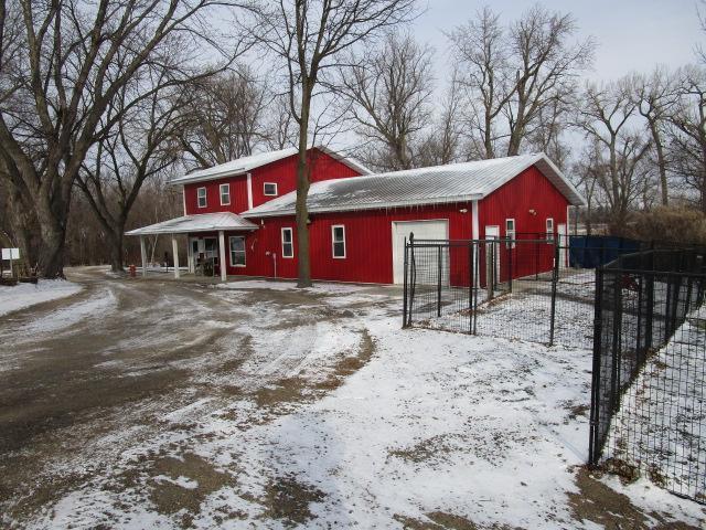 exterior space with fence and a detached garage