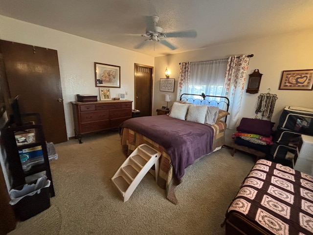 carpeted bedroom featuring a ceiling fan