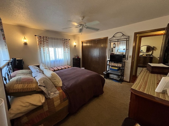 bedroom featuring carpet, a textured ceiling, ceiling fan, and a closet