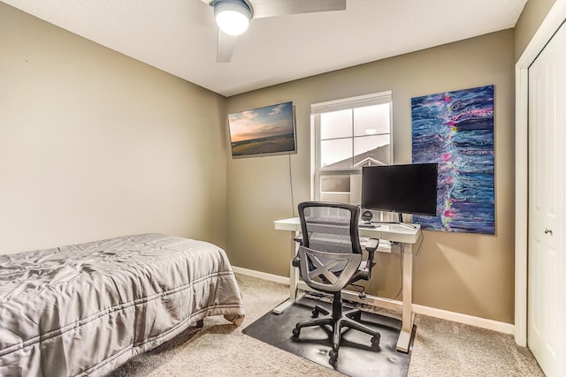 carpeted bedroom with baseboards and a ceiling fan