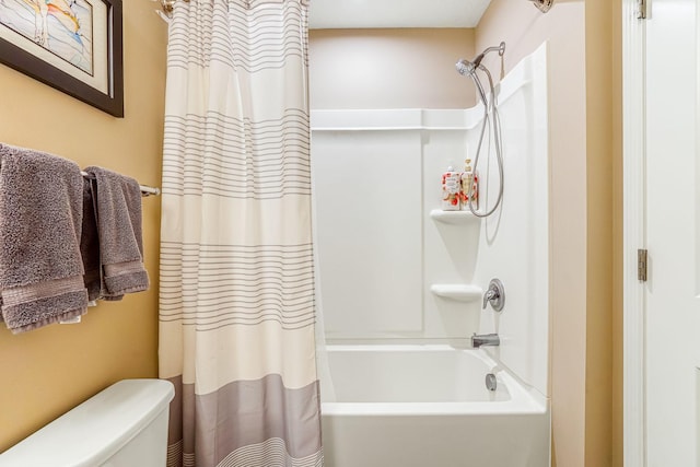 bathroom featuring toilet and shower / bathtub combination with curtain