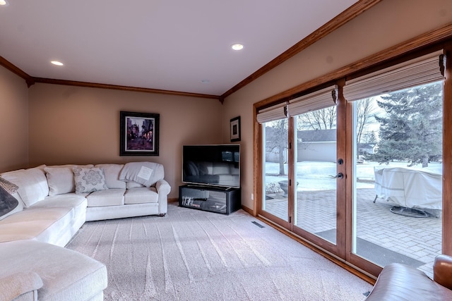 living area featuring recessed lighting, light colored carpet, visible vents, ornamental molding, and baseboards