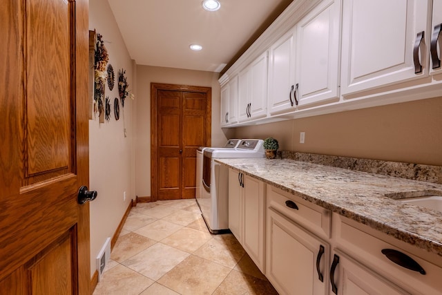 clothes washing area with washing machine and dryer, recessed lighting, visible vents, baseboards, and cabinet space