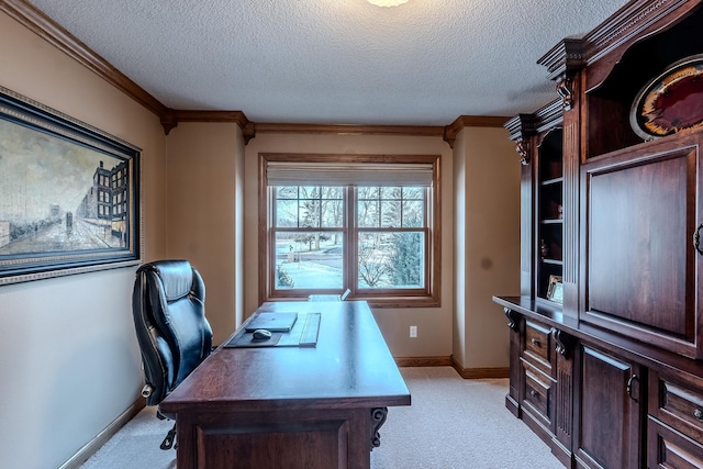 office area featuring ornamental molding, light carpet, a textured ceiling, and baseboards