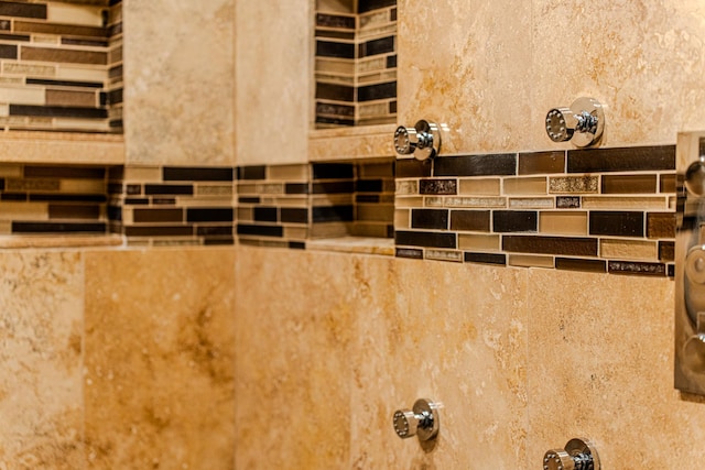 interior details with a tile shower