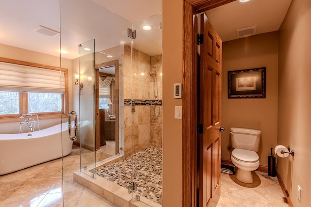 full bath featuring toilet, a stall shower, visible vents, and a soaking tub