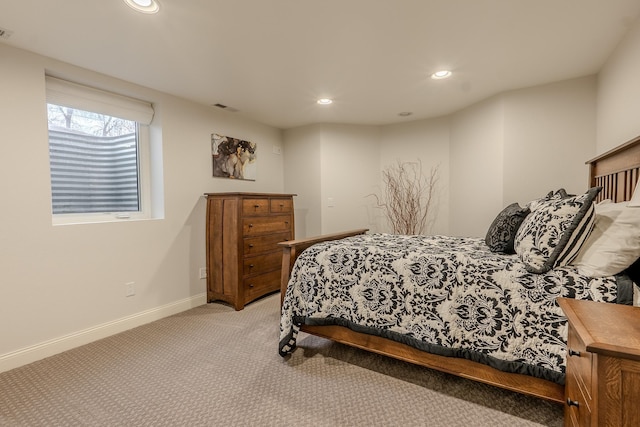 bedroom featuring recessed lighting, light colored carpet, visible vents, and baseboards