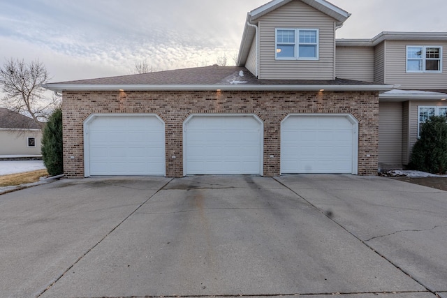 garage featuring driveway