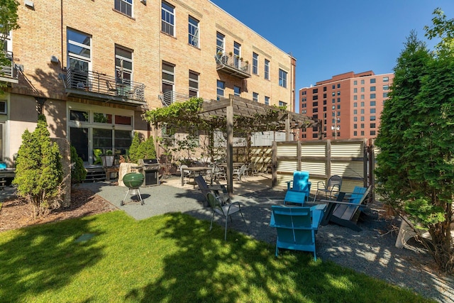 exterior space with grilling area and a pergola