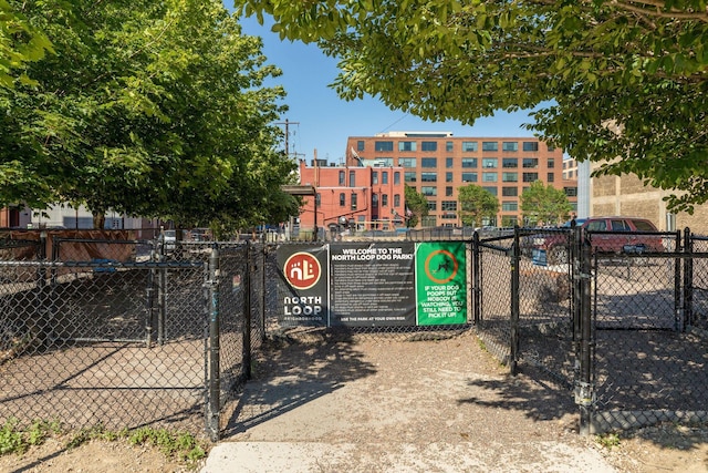 view of gate with fence