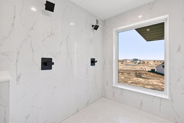 full bath with a marble finish shower