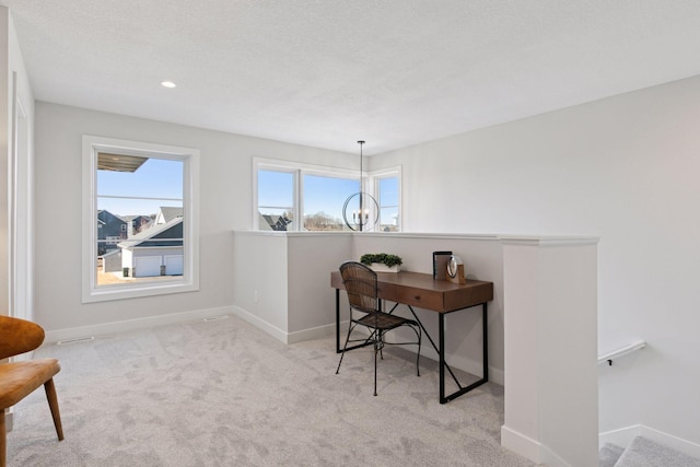 carpeted office space with baseboards, a chandelier, a textured ceiling, and recessed lighting