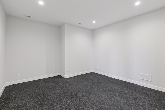 unfurnished room with baseboards, visible vents, and recessed lighting