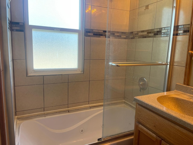 bathroom with combined bath / shower with glass door and vanity